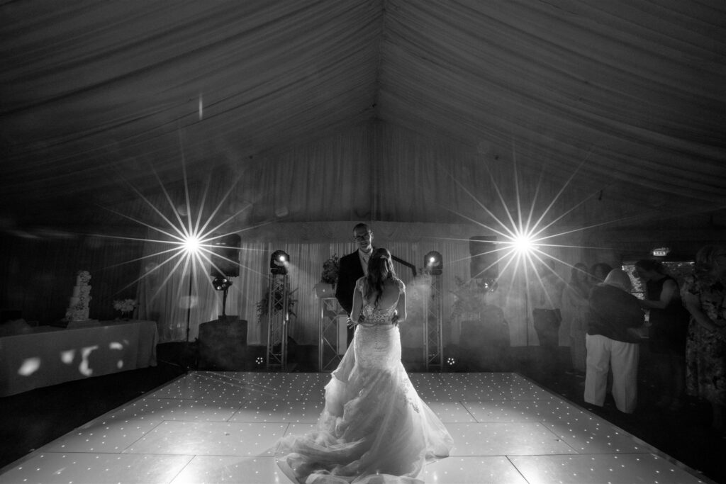 Bride and Groom dancing inside the marquee at the Delta Hotels Forest of Arden