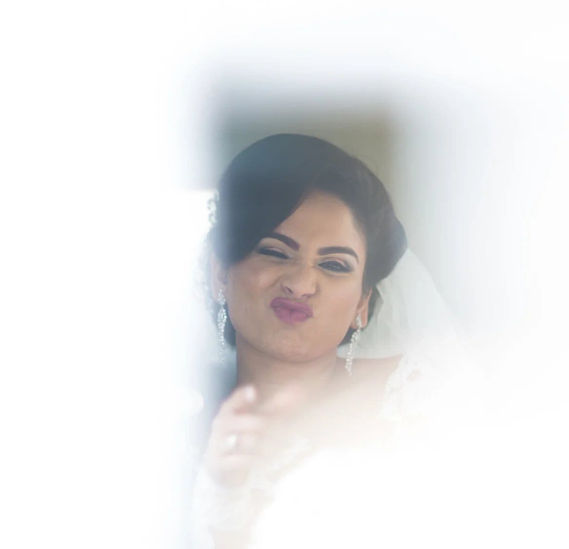 Bride pulling a funny face at camera