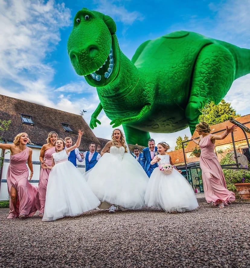 Bride and bridesmaids running away whilst dinosaur is chasing them