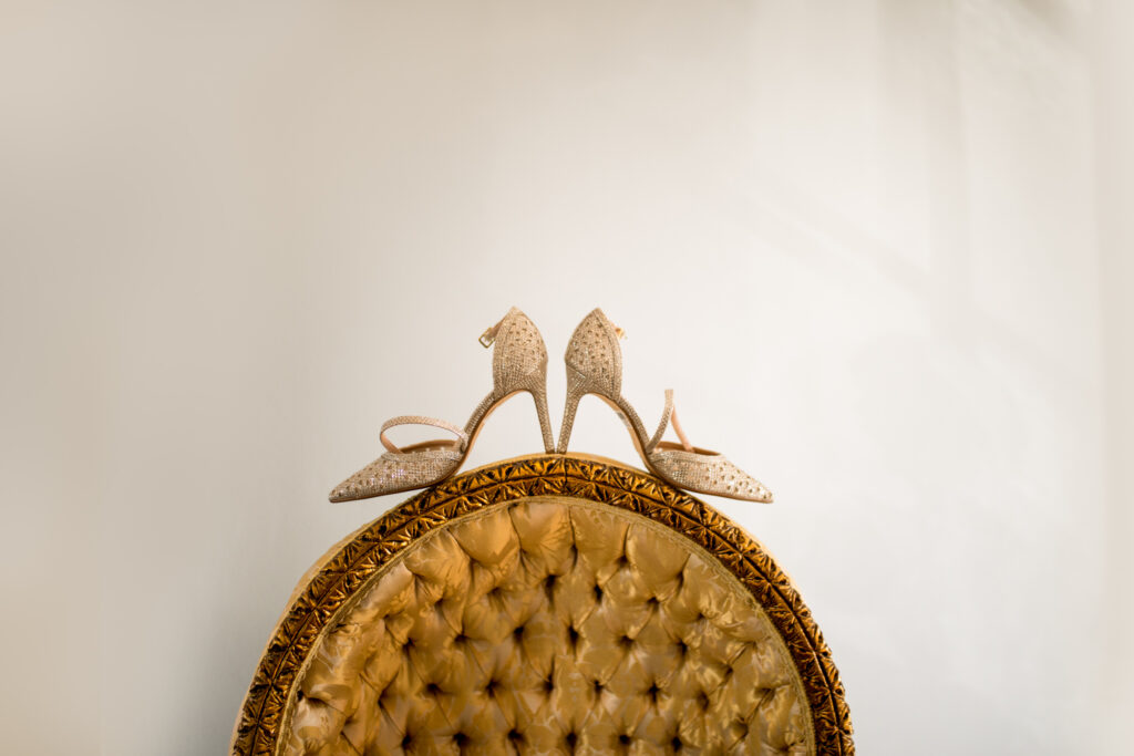 Brides shoes placed on a chair ready for her Stanbrook Abbey wedding